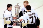 RALEIGH, NC - MAY 26:  Sidney Crosby #87, Sergei Gonchar #55 and Evgeni Malkin #71 of the Pittsburgh Penguins hold the Prince of Wales trophy after defeating the Carolina Hurricanes 4-1 in Game Four of the Eastern Conference Championship Round of the 2009 Stanley Cup Playoffs at RBC Center May 26, 2009 in Raleigh, North Carolina.  (Photo by Grant Halverson/Getty Images)