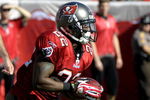 TAMPA, FL - DECEMBER 21: Running back Clifton Smith #22 of the Tampa Bay Buccaneers returns a kick against the San Diego Chargers at Raymond James Stadium on December 21, 2008 in Tampa, Florida.  (Photo by Al Messerschmidt/Getty Images)