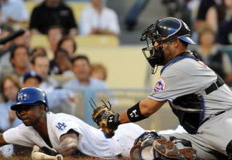 LOS ANGELES, CA - MAY 18:  Juan Pierre #9 of the Los Angeles Dodgers slides in ahead of the tag of Ramon Castro #11 of the New York Mets to score a run for a 1-0 lead during the first inning at Dodger Stadium on May 18, 2009 in Los Angeles, California.  (Photo by Harry How/Getty Images)