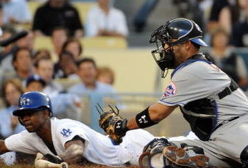 LOS ANGELES, CA - MAY 18:  Juan Pierre #9 of the Los Angeles Dodgers slides in ahead of the tag of Ramon Castro #11 of the New York Mets to score a run for a 1-0 lead during the first inning at Dodger Stadium on May 18, 2009 in Los Angeles, California.  (Photo by Harry How/Getty Images)