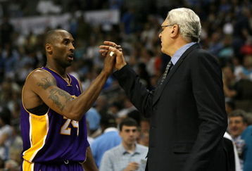 DENVER - MAY 29:  (L-R) Kobe Bryant #24 of the Los Angeles Lakers shakes hands with head coach Phil Jackson as Bryant is taken out of the game in the fourth quarter against the Denver Nuggets in Game Six of the Western Conference Finals during the 2009 NBA Playoffs at Pepsi Center on May 29, 2009 in Denver, Colorado. NOTE TO USER: User expressly acknowledges and agrees that, by downloading and or using this photograph, User is consenting to the terms and conditions of the Getty Images License Agreement.  (Photo by Doug Pensinger/Getty Images)