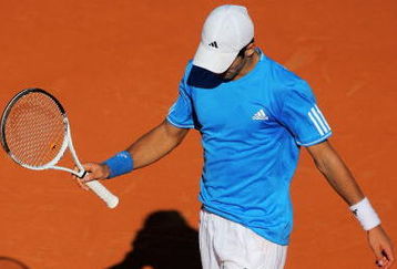 PARIS - MAY 30:  Novak Djokovic of Serbia reacts as he heads towards defeat during his Men's Singles Third Round match against Philip Kohlschreiber of Germany on day seven of the French Open at Roland Garros on May 30, 2009 in Paris, France.  (Photo by Matthew Stockman/Getty Images)