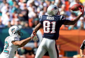 MIAMI - NOVEMBER 23: Wide receiver Randy Moss #81 of the New England Patriots pulls in a one-handed catch over cornerback Jason Allen #32 of the Miami Dolphins at Dolphin Stadium on November 23, 2008 in Miami, Florida.  (Photo by Doug Benc/Getty Images)
