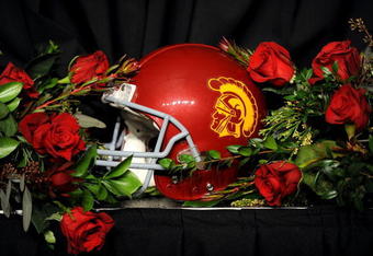 PASADENA, CA - JANUARY 01:  A USC Trojans helmet sits on a table surrounded by roses after USC defeated the Penn State Nittany Lions at the 95th Rose Bowl Game presented by Citi on January 1, 2009 at the Rose Bowl in Pasadena, California.  (Photo by Harry How/Getty Images)