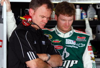 DOVER, DE - MAY 30:  Interim crew chief Lance McGrew (L) stands in the garage with Dale Earnhardt Jr., driver of the #88 AMP Energy/National Guard Chevrolet, during practice for the NASCAR Sprint Cup Series Autism Speaks 400 at Dover International Speedway on May 30, 2009 in Dover, Delaware.  (Photo by Jason Smith/Getty Images for NASCAR)