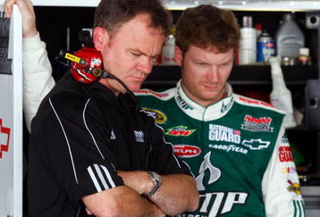 DOVER, DE - MAY 30:  Interim crew chief Lance McGrew (L) stands in the garage with Dale Earnhardt Jr., driver of the #88 AMP Energy/National Guard Chevrolet, during practice for the NASCAR Sprint Cup Series Autism Speaks 400 at Dover International Speedway on May 30, 2009 in Dover, Delaware.  (Photo by Jason Smith/Getty Images for NASCAR)