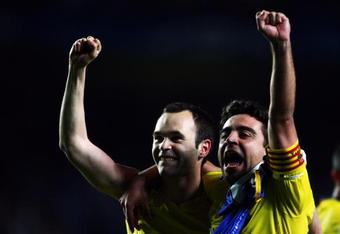 LONDON, ENGLAND - MAY 06:  (L-R)  Andres Iniesta and Xavi of Barcelona celebrate victory in the UEFA Champions League Semi Final match between Chelsea and Barcelona at Stamford Bridge on May 6, 2009 in London, England.  (Photo by Jamie McDonald/Getty Images)