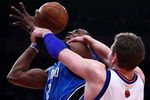 NEW YORK - FEBRUARY 25:  Dwight Howard #12 of the Orlando Magic is fouled by David Lee #42 of the New York Knicks at Madison Square Garden February 25, 2009 in New York City. NOTE TO USER: User expressly acknowledges and agrees that, by downloading and/or using this Photograph, User is consenting to the terms and conditions of the Getty Images License Agreement.  (Photo by Chris McGrath/Getty Images)