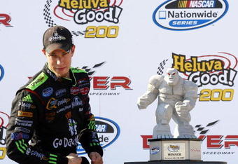 DOVER, DE - MAY 30:  Brad Keselowski, driver of the #88 GoDaddy.com Chevrolet, poses with the trophy after winning the NASCAR Nationwide Series Heluva Good! 200 at Dover International Speedway on May 30, 2009 in Dover, Delaware.  (Photo by Jason Smith/Getty Images for NASCAR)