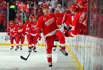 DETROIT - MAY 30:  Justin Abdelkader #8 of the Detroit Red Wings celebrates with his bench after scoring a goal in the third period against the Pittsburgh Penguins during Game 1 of the 2009 NHL Stanley Cup Finals at Joe Louis Arena on May 30, 2009 in Detroit, Michigan.  (Photo by Jim McIsaac/Getty Images)