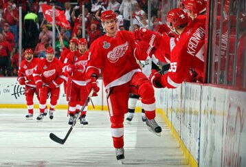DETROIT - MAY 30:  Justin Abdelkader #8 of the Detroit Red Wings celebrates with his bench after scoring a goal in the third period against the Pittsburgh Penguins during Game 1 of the 2009 NHL Stanley Cup Finals at Joe Louis Arena on May 30, 2009 in Detroit, Michigan.  (Photo by Jim McIsaac/Getty Images)
