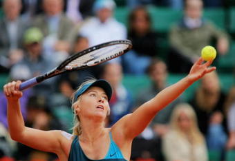 PARIS - MAY 27:  Maria Sharapova of Russia serves during her Women's Singles Second Round match against Nadia Petrova of Russia on day four of the French Open at Roland Garros on May 27, 2009 in Paris, France.  (Photo by Matthew Stockman/Getty Images)