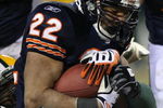 CHICAGO - DECEMBER 22:  Matt Forte #22 of the Chicago Bears is tackled while running against the Green Bay Packers on December 22, 2008 at Soldier Field in Chicago, Illinois. The Bears defeated the Packers 20-17 in overtime. (Photo by Jonathan Daniel/Getty Images)