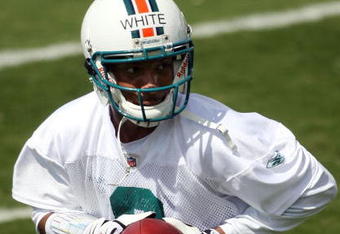 DAVIE, FL - MAY 02:  Rookie quarterback Pat White  #6 of the Miami Dolphins drops back to pass during mini camp on May 2, 2009 at the Miami Dolphins Training facility in Davie, Florida.  (Photo by Marc Serota/Getty Images)