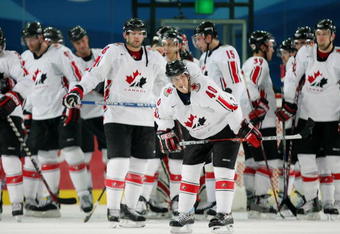 TURIN, ITALY - FEBRUARY 22:  Team Canada stands dejected after falling to Russia 2-0 in their quarter final of the men's ice hockey match during Day 12 of the Turin 2006 Winter Olympic Games on February 22, 2006 at the Torino Esposizioni in Turin, Italy.  (Photo by Al Bello/Getty Images)
