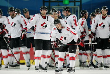 TURIN, ITALY - FEBRUARY 22:  Team Canada stands dejected after falling to Russia 2-0 in their quarter final of the men's ice hockey match during Day 12 of the Turin 2006 Winter Olympic Games on February 22, 2006 at the Torino Esposizioni in Turin, Italy.  (Photo by Al Bello/Getty Images)