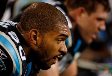 CHARLOTTE, NC - JANUARY 10:  Julius Peppers #90 of the Carolina Panthers looks on from the bench during the fourth quarter of the game against the Arizona Cardinals during the NFC Divisional Playoff Game on January 10, 2009 at Bank of America Stadium in Charlotte, North Carolina.  (Photo by Streeter Lecka/Getty Images)