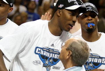 ORLANDO, FL - MAY 30:  Dwight Howard #12 of the Orlando Magic hugs Orlando Magic owner Richard DeVos on the court after defeating the Cleveland Cavaliers of the Orlando Magic in Game Six of the Eastern Conference Finals during the 2009 Playoffs at Amway Arena on May 30, 2009 in Orlando, Florida. NOTE TO USER: User expressly acknowledges and agrees that, by downloading and or using this photograph, User is consenting to the terms and conditions of the Getty Images License Agreement  (Photo by Elsa/Getty Images)
