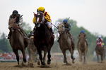 BALTIMORE - MAY 16:  Calvin Borel, riding Rachel Alexandra, crosses the finish line ahead of Mine That Bird to win the 134th Preakness Stakes at Pimlico Race Course on May 16, 2009 in Baltimore, Maryland.  (Photo by Matthew Stockman/Getty Images)