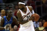 CLEVELAND - MAY 28:  LeBron James #23 of the Cleveland Cavaliers handles the ball against Mickael Pietrus #20 of the Orlando Magic in Game Five of the Eastern Conference Finals during the 2009 Playoffs at Quicken Loans Arena on May 28, 2009 in Cleveland, Ohio. NOTE TO USER: User expressly acknowledges and agrees that, by downloading and or using this photograph, User is consenting to the terms and conditions of the Getty Images License Agreement  (Photo by Elsa/Getty Images)