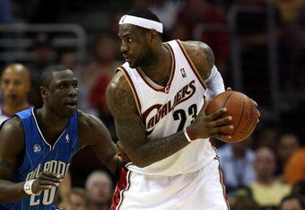 CLEVELAND - MAY 28:  LeBron James #23 of the Cleveland Cavaliers handles the ball against Mickael Pietrus #20 of the Orlando Magic in Game Five of the Eastern Conference Finals during the 2009 Playoffs at Quicken Loans Arena on May 28, 2009 in Cleveland, Ohio. NOTE TO USER: User expressly acknowledges and agrees that, by downloading and or using this photograph, User is consenting to the terms and conditions of the Getty Images License Agreement  (Photo by Elsa/Getty Images)