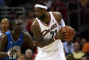 CLEVELAND - MAY 28:  LeBron James #23 of the Cleveland Cavaliers handles the ball against Mickael Pietrus #20 of the Orlando Magic in Game Five of the Eastern Conference Finals during the 2009 Playoffs at Quicken Loans Arena on May 28, 2009 in Cleveland, Ohio. NOTE TO USER: User expressly acknowledges and agrees that, by downloading and or using this photograph, User is consenting to the terms and conditions of the Getty Images License Agreement  (Photo by Elsa/Getty Images)
