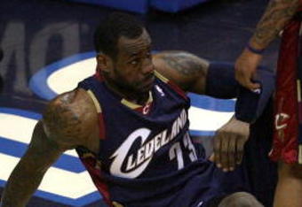 ORLANDO, FL - MAY 30: LeBron James #23 of the Cleveland Cavaliers sits on the court after being fouled by the Orlando Magic in Game Six of the Eastern Conference Finals during the 2009 Playoffs at Amway Arena on May 30, 2009 in Orlando, Florida. NOTE TO USER: User expressly acknowledges and agrees that, by downloading and or using this photograph, User is consenting to the terms and conditions of the Getty Images License Agreement  (Photo by Doug Benc/Getty Images)