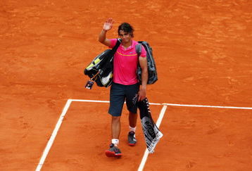 PARIS - MAY 31:  Defeated champion Rafael Nadal of Spain waves to the crowd as he walks off court following his defeat during the Men's Singles Fourth Round match against Robin Soderling of Sweden on day eight of the French Open at Roland Garros on May 31, 2009 in Paris, France.  (Photo by Clive Brunskill/Getty Images)