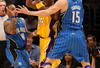 LOS ANGELES - JANUARY 16:  Kobe Bryant #24 of the Los Angeles Lakers looks to make a play to the basket against Jameer Nelson #14 and Hedo Turkoglu #15 of the Orlando Magic during their NBA game on January 16, 2009 at Staples Center in Los Angeles, California. The Magic won 109-103.   NOTE TO USER: User expressly acknowledges and agrees that, by downloading and/or using this Photograph, user is consenting to the terms and conditions of the Getty Images License Agreement. (Photo by Stephen Dunn/Getty Images)