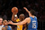 LOS ANGELES - JANUARY 16:  Kobe Bryant #24 of the Los Angeles Lakers looks to make a play to the basket against Jameer Nelson #14 and Hedo Turkoglu #15 of the Orlando Magic during their NBA game on January 16, 2009 at Staples Center in Los Angeles, California. The Magic won 109-103.   NOTE TO USER: User expressly acknowledges and agrees that, by downloading and/or using this Photograph, user is consenting to the terms and conditions of the Getty Images License Agreement. (Photo by Stephen Dunn/Getty Images)