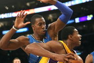 LOS ANGELES - JANUARY 16: Andrew Bynum #17 of the Los Angeles Lakers drives baseline against Dwight Howard #12 of the Orlando Magic during their NBA game on January 16, 2009 at Staples Center in Los Angeles, California. The Magic won 109-103. NOTE TO USER: User expressly acknowledges and agrees that, by downloading and/or using this Photograph, user is consenting to the terms and conditions of the Getty Images License Agreement. (Photo by Stephen Dunn/Getty Images)