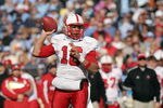 CHAPEL HILL - NOVEMBER 22:  Quarterback Russell Wilson #16 of the North Carolina State Wolfpack passes the ball during the game against the North Carolina Tar Heels at Kenan Stadium on November 22, 2008 in Chapel Hill, North Carolina. ( Photo by: Streeter Lecka/Getty Images)