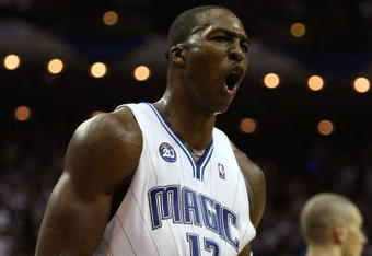 ORLANDO, FL - MAY 30:  Dwight Howard #12 of the Orlando Magic reacts after a play late in the game against the Cleveland Cavaliers in Game Six of the Eastern Conference Finals during the 2009 Playoffs at Amway Arena on May 30, 2009 in Orlando, Florida. NOTE TO USER: User expressly acknowledges and agrees that, by downloading and or using this photograph, User is consenting to the terms and conditions of the Getty Images License Agreement  (Photo by Elsa/Getty Images)