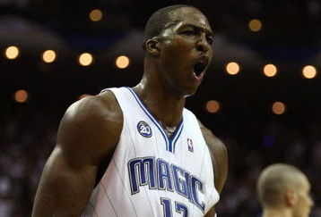 ORLANDO, FL - MAY 30:  Dwight Howard #12 of the Orlando Magic reacts after a play late in the game against the Cleveland Cavaliers in Game Six of the Eastern Conference Finals during the 2009 Playoffs at Amway Arena on May 30, 2009 in Orlando, Florida. NOTE TO USER: User expressly acknowledges and agrees that, by downloading and or using this photograph, User is consenting to the terms and conditions of the Getty Images License Agreement  (Photo by Elsa/Getty Images)
