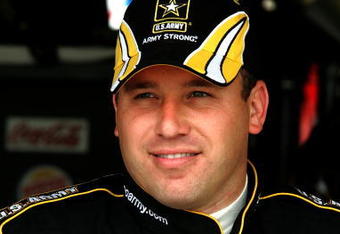 DOVER, DE - MAY 29:  Ryan Newman, driver of the #39 U.S Army Chevrolet, stands in the garage during practice for the NASCAR Sprint Cup Series Autism Speaks 400 at Dover International Speedway on May 29, 2009 in Dover, Delaware.  (Photo by Jerry Markland/Getty Images for NASCAR)