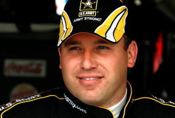 DOVER, DE - MAY 29:  Ryan Newman, driver of the #39 U.S Army Chevrolet, stands in the garage during practice for the NASCAR Sprint Cup Series Autism Speaks 400 at Dover International Speedway on May 29, 2009 in Dover, Delaware.  (Photo by Jerry Markland/Getty Images for NASCAR)