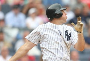 NEW YORK - MAY 24:  Mark Teixeira #25 of the New York Yankees at bat against the Philadelphia Phillies on May 24, 2009 at Yankee Stadium in the Bronx borough of New York City.  (Photo by Nick Laham/Getty Images)