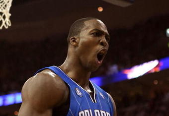 CLEVELAND - MAY 28:  Dwight Howard #12 of the Orlando Magic reacts after a play against the Cleveland Cavaliers in Game Five of the Eastern Conference Finals during the 2009 Playoffs at Quicken Loans Arena on May 28, 2009 in Cleveland, Ohio. NOTE TO USER: User expressly acknowledges and agrees that, by downloading and or using this photograph, User is consenting to the terms and conditions of the Getty Images License Agreement  (Photo by Elsa/Getty Images)