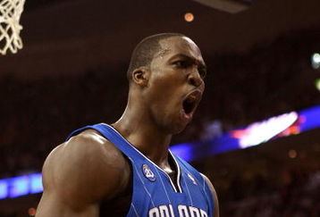 CLEVELAND - MAY 28:  Dwight Howard #12 of the Orlando Magic reacts after a play against the Cleveland Cavaliers in Game Five of the Eastern Conference Finals during the 2009 Playoffs at Quicken Loans Arena on May 28, 2009 in Cleveland, Ohio. NOTE TO USER: User expressly acknowledges and agrees that, by downloading and or using this photograph, User is consenting to the terms and conditions of the Getty Images License Agreement  (Photo by Elsa/Getty Images)