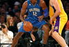 LOS ANGELES - JANUARY 16:  Dwight Howard #12 of the Orlando Magic dribbles the ball to the basket against Pau Gasol #16 of the Los Angeles Lakers during their NBA game on January 16, 2009 at Staples Center in Los Angeles, California. The Magic won 109-103.   NOTE TO USER: User expressly acknowledges and agrees that, by downloading and/or using this Photograph, user is consenting to the terms and conditions of the Getty Images License Agreement. (Photo by Stephen Dunn/Getty Images)es)