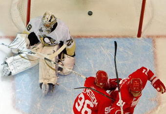 DETROIT - MAY 30:  Marian Hossa #81 and Tomas Holmstrom #96 of the Detroit Red Wings celebrate the goal of teammate Brad Stuart #23 (not pictured) against Marc-Andre Fleury #29 of the Pittsburgh Penguins during Game 1 of the 2009 NHL Stanley Cup Finals at Joe Louis Arena on May 30, 2009 in Detroit, Michigan.  (Photo by Jim McIsaac/Getty Images)