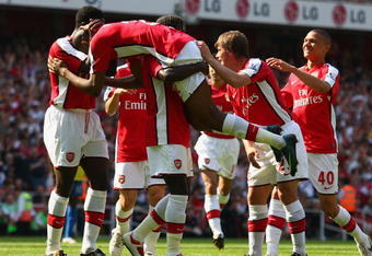 LONDON, ENGLAND - MAY 24:  Abou Diaby of Arsenal celebrates with teammates after scoring his team's third goal during the Barclays Premier League match between Arsenal and Stoke City at Emirates Stadium on May 24, 2009 in London, England.  (Photo by Ryan Pierse/Getty Images)