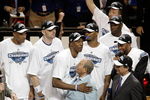 ORLANDO, FL - MAY 30: Dwight Howard #12 of the Orlando Magic hugs Orlando Magic owner Richard DeVos on the court after defeating the Cleveland Cavaliers of the Orlando Magic in Game Six of the Eastern Conference Finals during the 2009 Playoffs at Amway Arena on May 30, 2009 in Orlando, Florida. NOTE TO USER: User expressly acknowledges and agrees that, by downloading and or using this photograph, User is consenting to the terms and conditions of the Getty Images License Agreement  (Photo by Doug Benc/Getty Images)