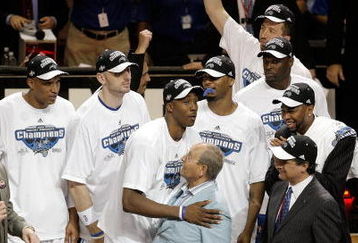 ORLANDO, FL - MAY 30: Dwight Howard #12 of the Orlando Magic hugs Orlando Magic owner Richard DeVos on the court after defeating the Cleveland Cavaliers of the Orlando Magic in Game Six of the Eastern Conference Finals during the 2009 Playoffs at Amway Arena on May 30, 2009 in Orlando, Florida. NOTE TO USER: User expressly acknowledges and agrees that, by downloading and or using this photograph, User is consenting to the terms and conditions of the Getty Images License Agreement  (Photo by Doug Benc/Getty Images)
