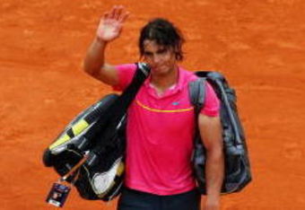 PARIS - MAY 31:  Defeated champion Rafael Nadal of Spain waves to the crowd as he walks off court following his defeat during the Men's Singles Fourth Round match against Robin Soderling of Sweden on day eight of the French Open at Roland Garros on May 31, 2009 in Paris, France.  (Photo by Clive Brunskill/Getty Images)