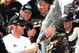 DOVER, DE - MAY 30: Dale Earnhardt Jr (3L), team owner of the #88 GoDaddy.com Chevrolet driven by Brad Kesleowski (C) sprays champagne in the victory lane during celebration for the NASCAR Nationwide Series Heluva Good! 200 at Dover International Speedway on May 30, 2009 in Dover, Delaware. (Photo by Jerry Markland/Getty Images for NASCAR)