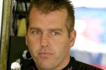 DARLINGTON, SC - MAY 08: Jeremy Mayfield, driver of the #41 SmallSponsor.com Toyota, stands in the garage during practice for the NASCAR Sprint Cup Series Southern 500 on May 8, 2009 at Darlington Raceway in Darlington, South Carolina.  (Photo by Jerry Markland/Getty Images for NASCAR)