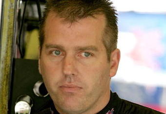 DARLINGTON, SC - MAY 08: Jeremy Mayfield, driver of the #41 SmallSponsor.com Toyota, stands in the garage during practice for the NASCAR Sprint Cup Series Southern 500 on May 8, 2009 at Darlington Raceway in Darlington, South Carolina.  (Photo by Jerry Markland/Getty Images for NASCAR)