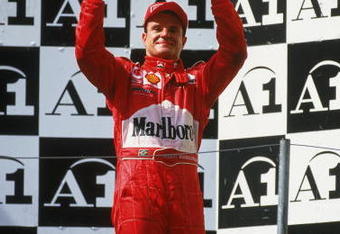 12 May 2002:  Ferrari driver and race runner-up Rubens Barrichello of Brazil stands on the podium as he celebrates a moral victory after the Austrian Formula One Grand Prix held at the A1 Ring, in Spielberg, Austria.Team-mate Michael Schumacher won the race but it should of been a Barrichello victory but under team orders he moved out of the way to allow Schumacher to overtake him and win the race. (Photo by Tom Shaw/Getty Images)