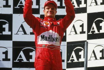 12 May 2002:  Ferrari driver and race runner-up Rubens Barrichello of Brazil stands on the podium as he celebrates a moral victory after the Austrian Formula One Grand Prix held at the A1 Ring, in Spielberg, Austria.Team-mate Michael Schumacher won the race but it should of been a Barrichello victory but under team orders he moved out of the way to allow Schumacher to overtake him and win the race. (Photo by Tom Shaw/Getty Images)